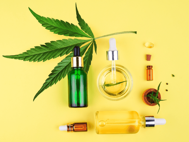 CBD products on yellow table