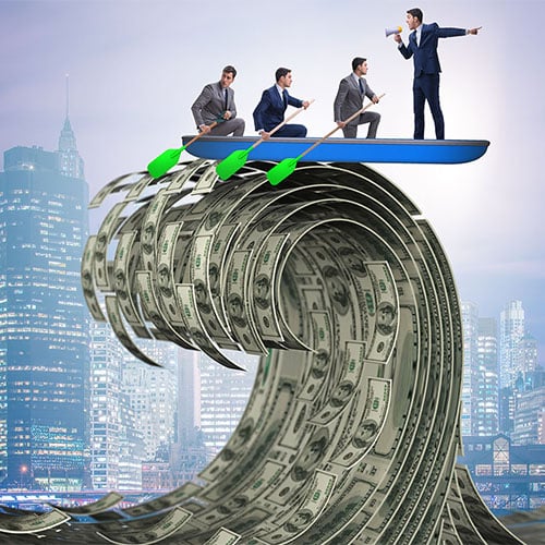 Business team canoeing on tidal wave of money